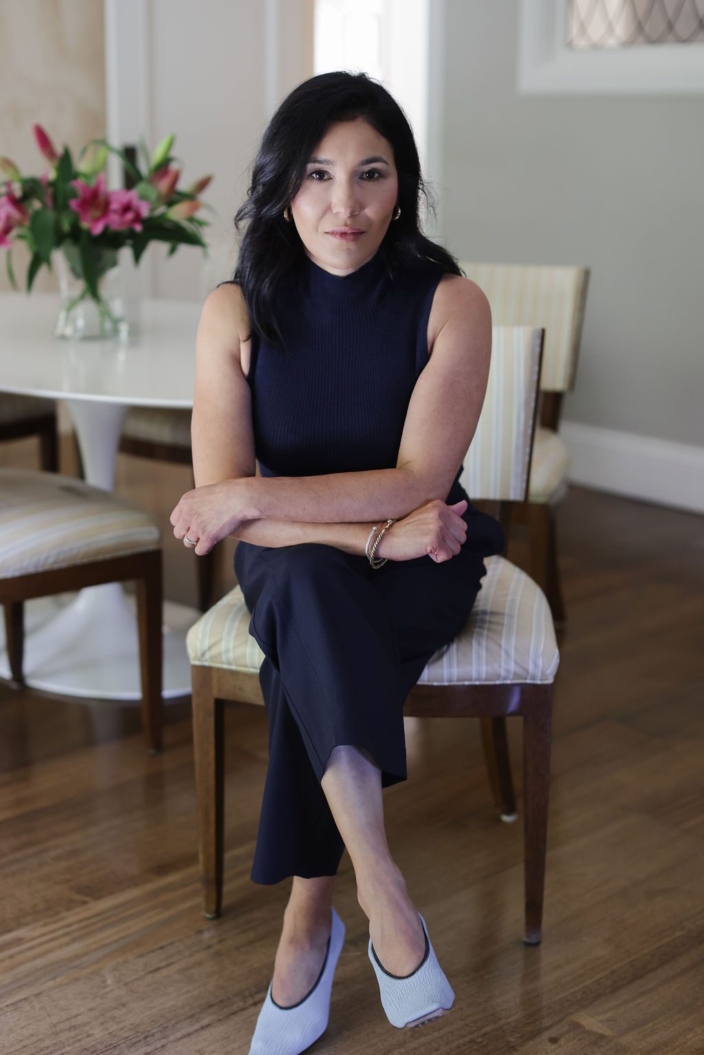 Jen Passetti seated at her dining table